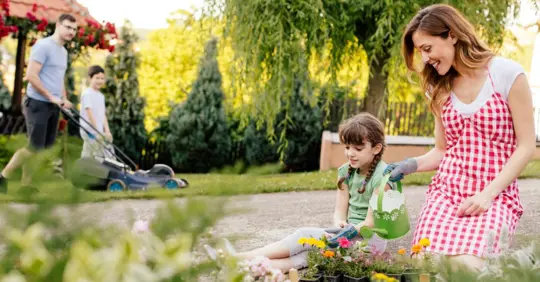 appy Family Gardening in a Backyard Together
